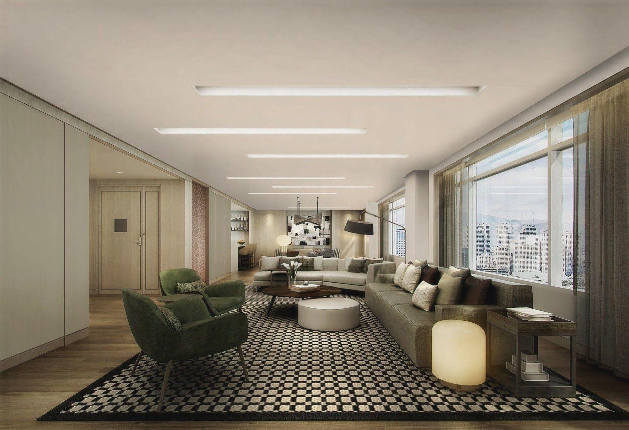 Seda Vertis North Quezon City Exterior foto The living room of a three-bedroom apartment